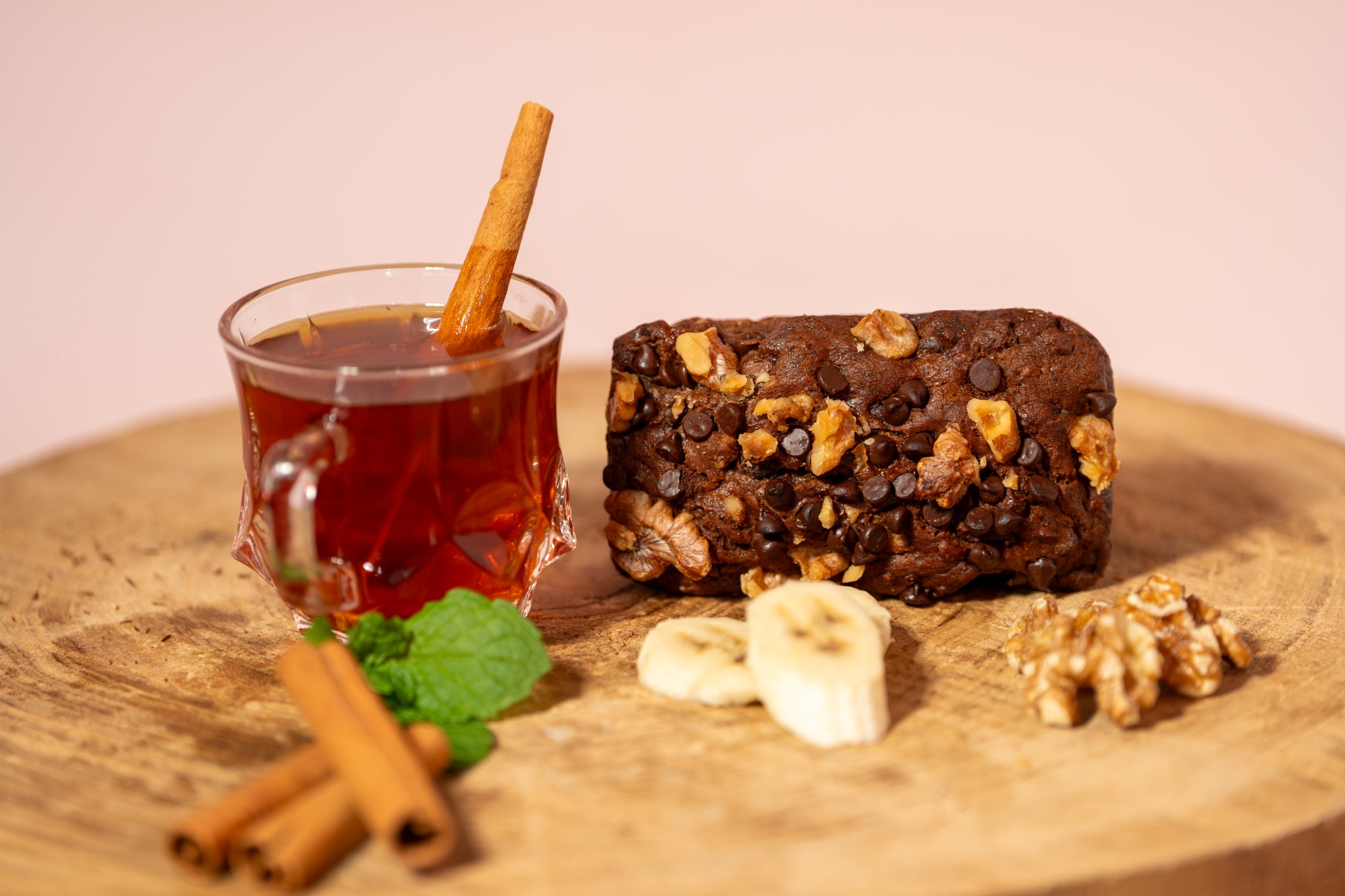 Slice of banana bread with a glass of tea